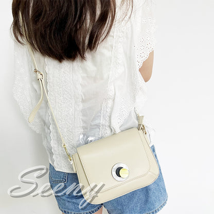 RUIWEI turn lock crossbody bag 44999  Cowhide bag niche design saddle bag new high-end texture bag